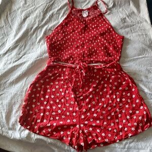 A beautiful women's beach outfit, perfect for summer. beautiful shorts and a flo